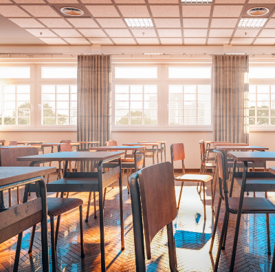 A classroom filled with desks and chairs.